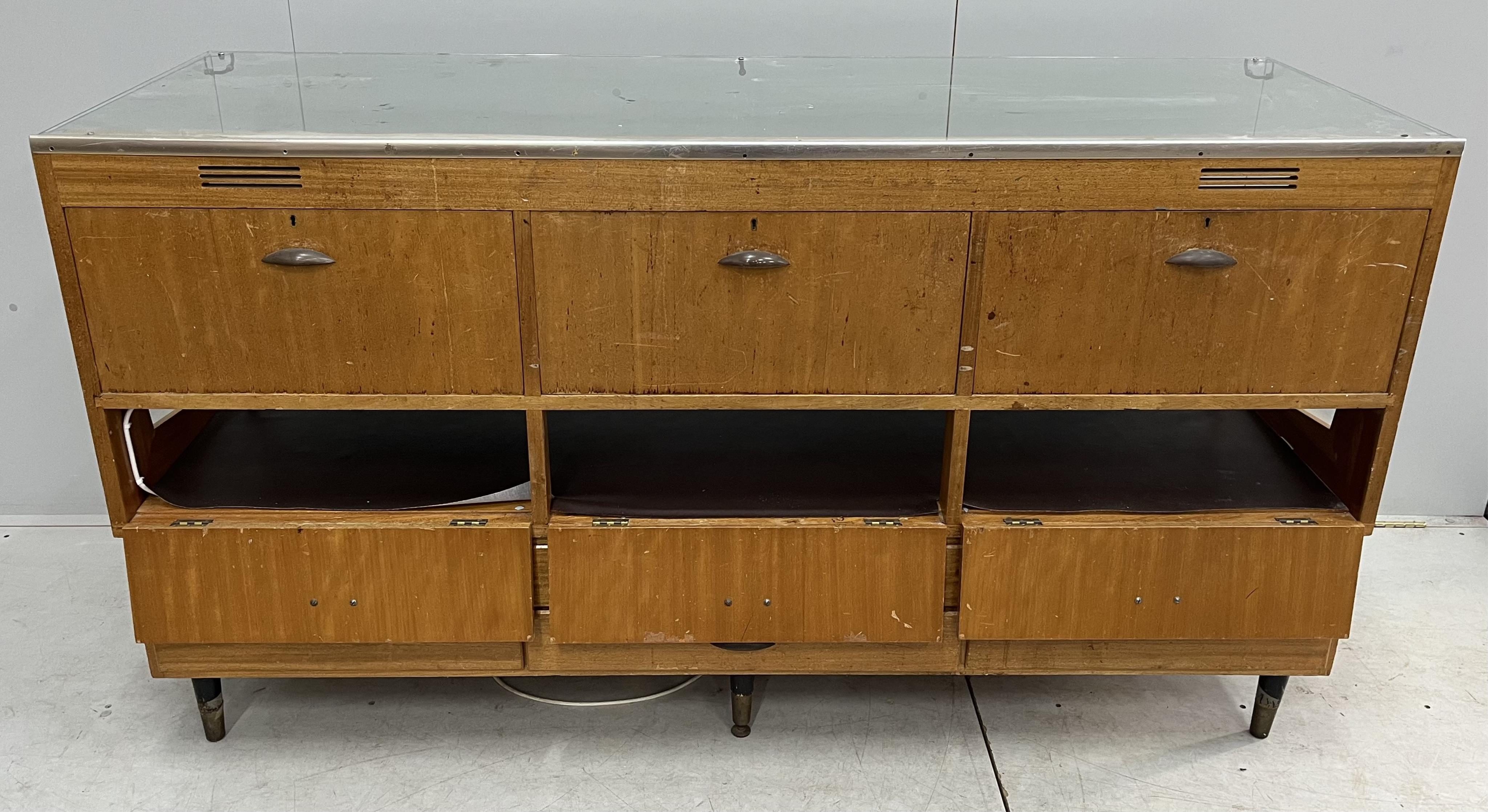 A mid century teak Parker Pen shop display cabinet, width 182cm, depth 62cm, height 99cm. Condition fair to good.
